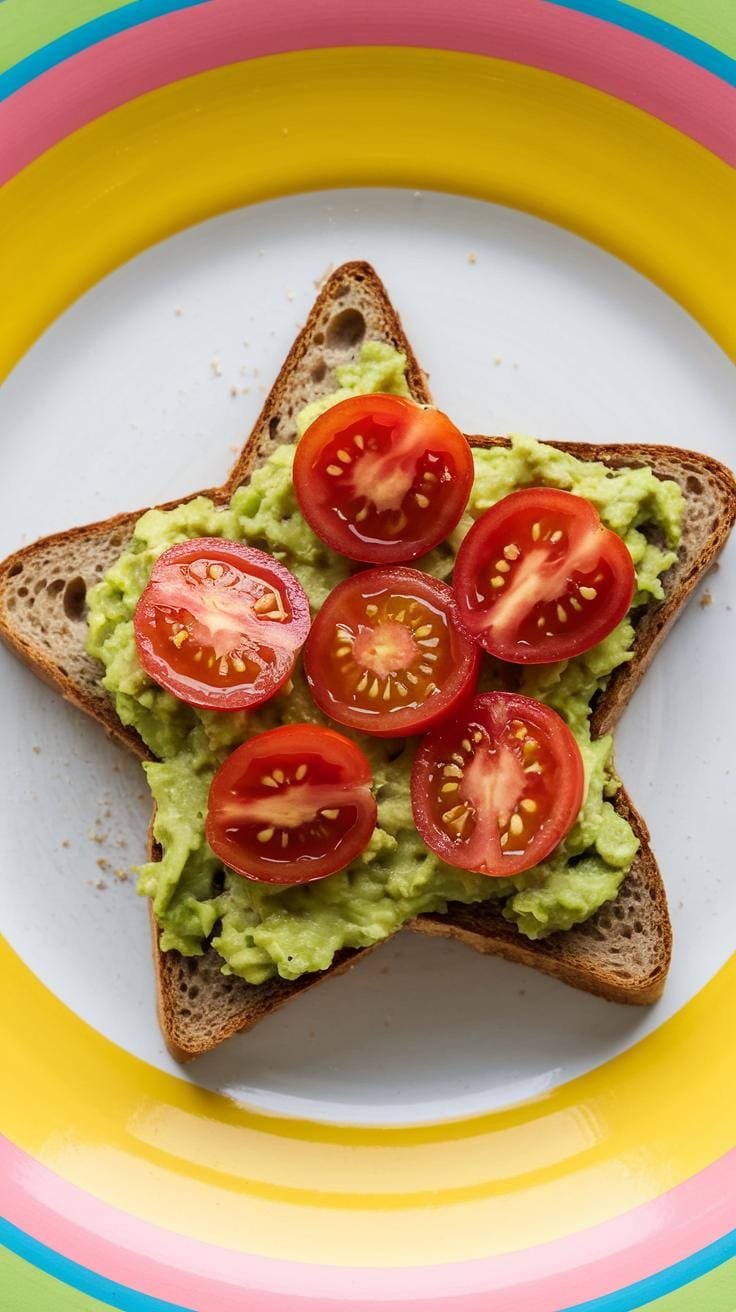 A star-shaped slice of whole-grain avocado toast with cherry tomatoes on a vibrant plate.