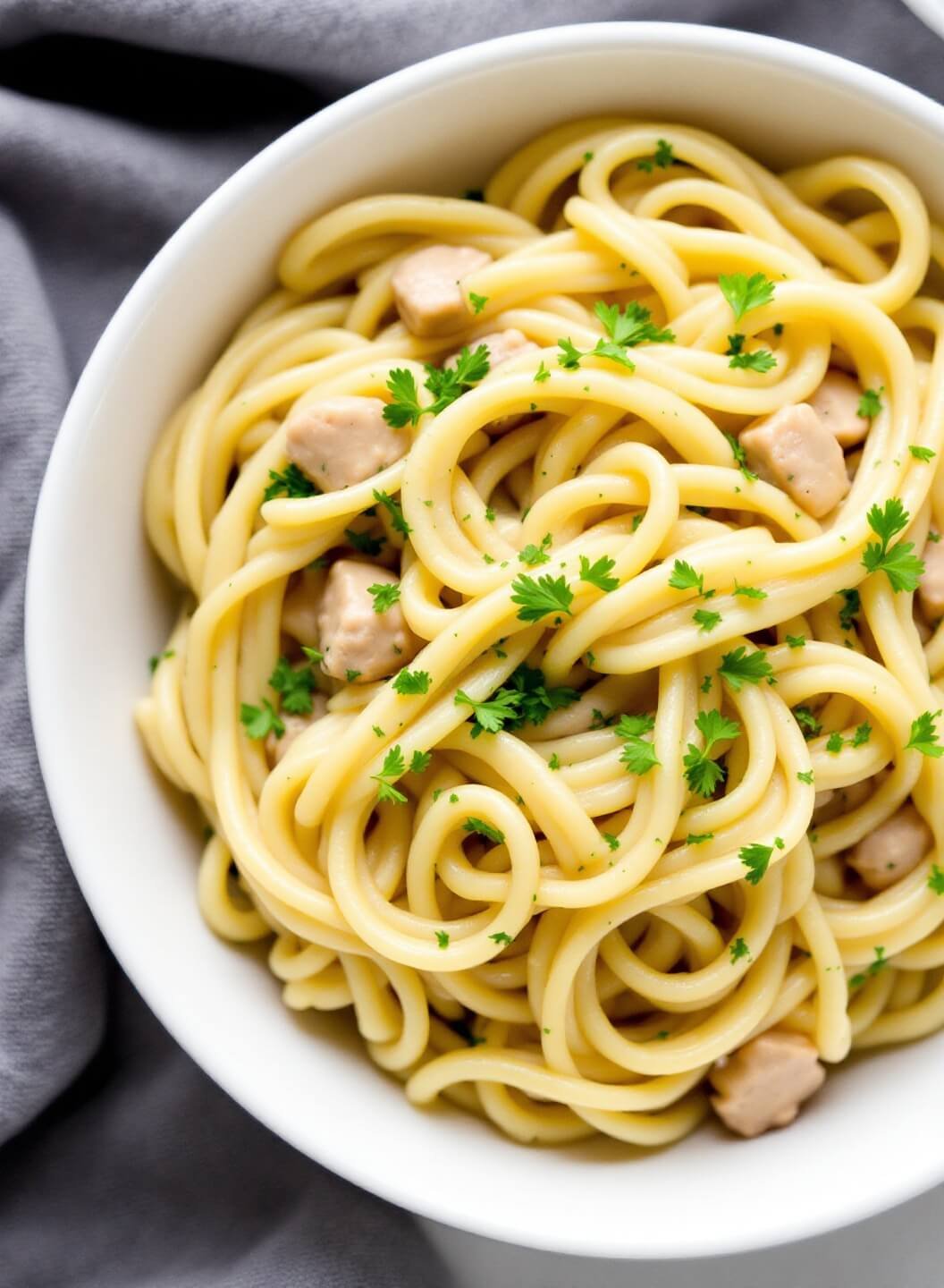 Creamy Keto Chicken Alfredo With Cauliflower Noodles 7 Keto alfredo pasta garnished with parsley in a white bowl