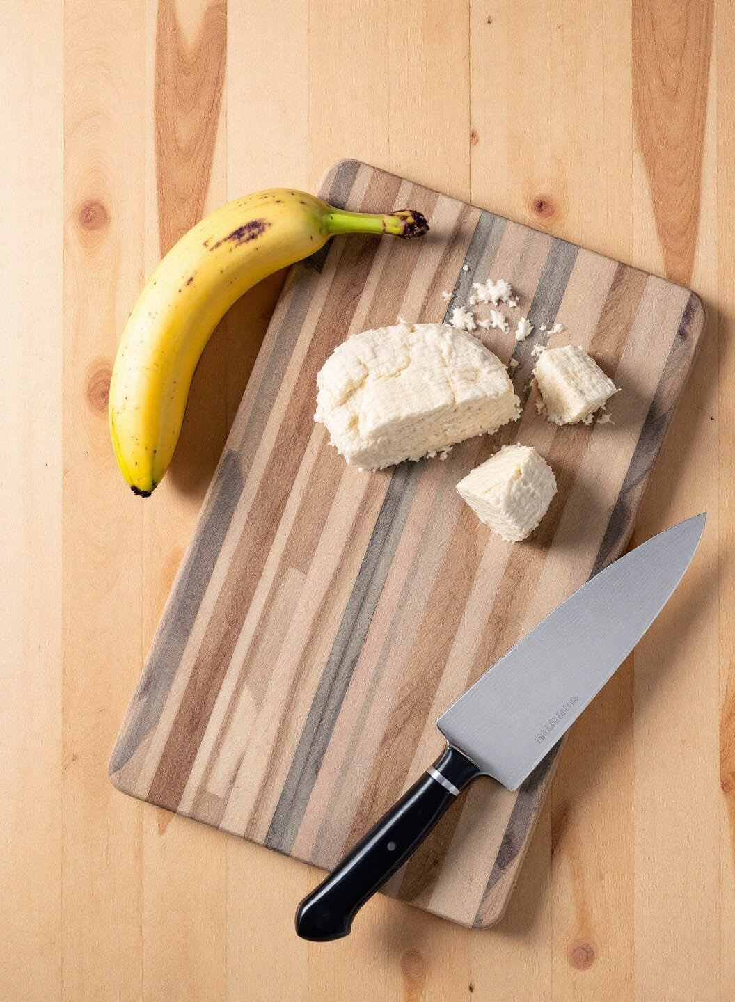 Classic Banana Bread Recipe (That Never Fails!) 3 Ripe bananas on a wooden cutting board under natural lighting
