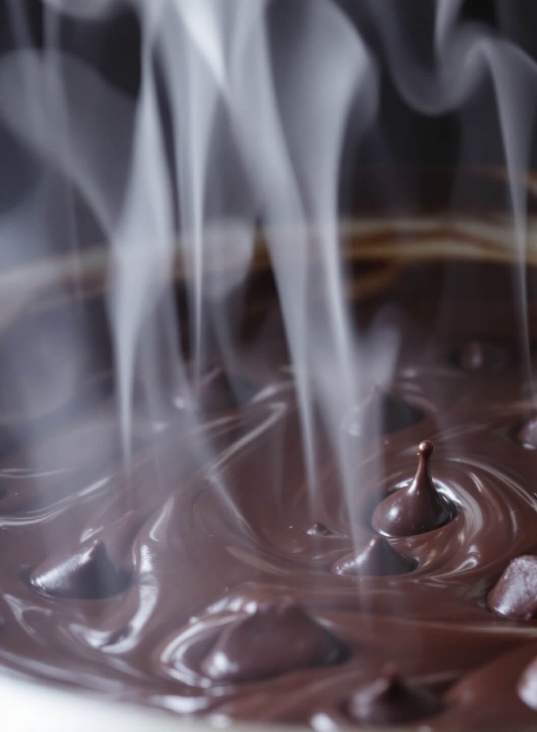 High-Protein Chocolate Mousse Pie With Almond Crust 4 Glossy swirls of melting dark chocolate chips with steam rising