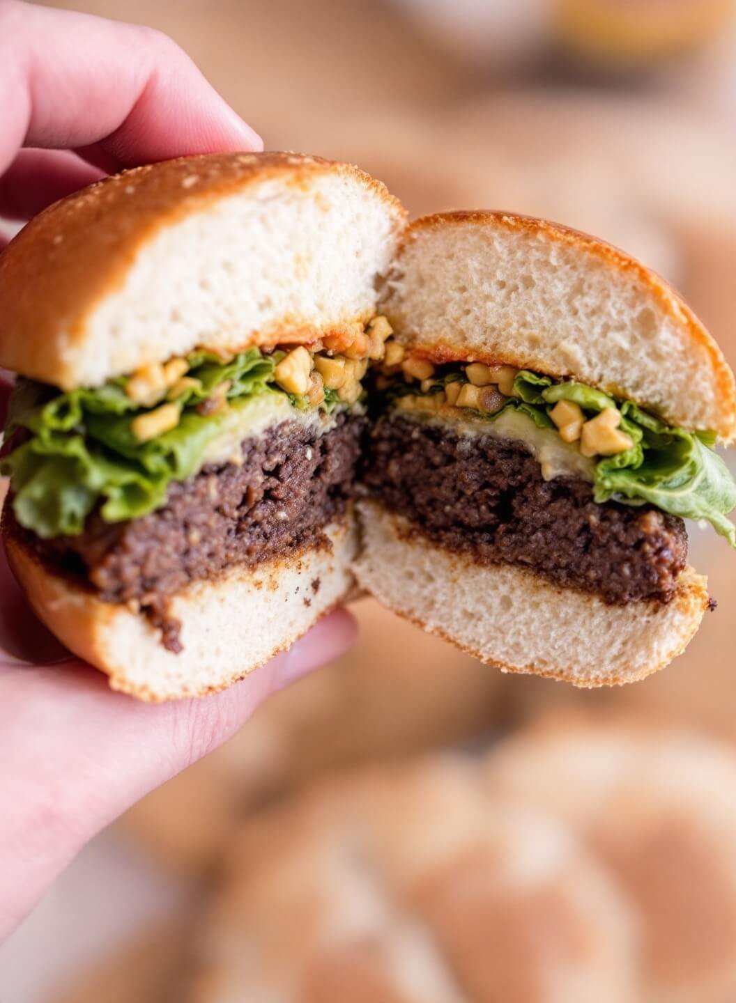 The Perfect Bunless Burger 7 Cross section of a juicy, bunless burger garnished with lettuce and tomatoes