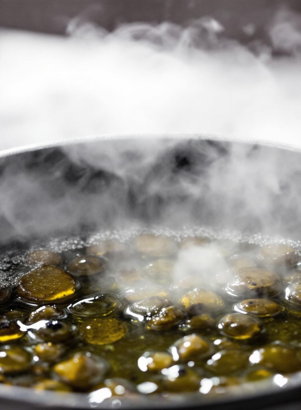 Keto Fish And Chips (Crispy Almond-Crusted Fish With Turnip Fries) 5 Thermometer in a deep frying pan showing the perfect temperature, with bubbling hot oil and steam rising