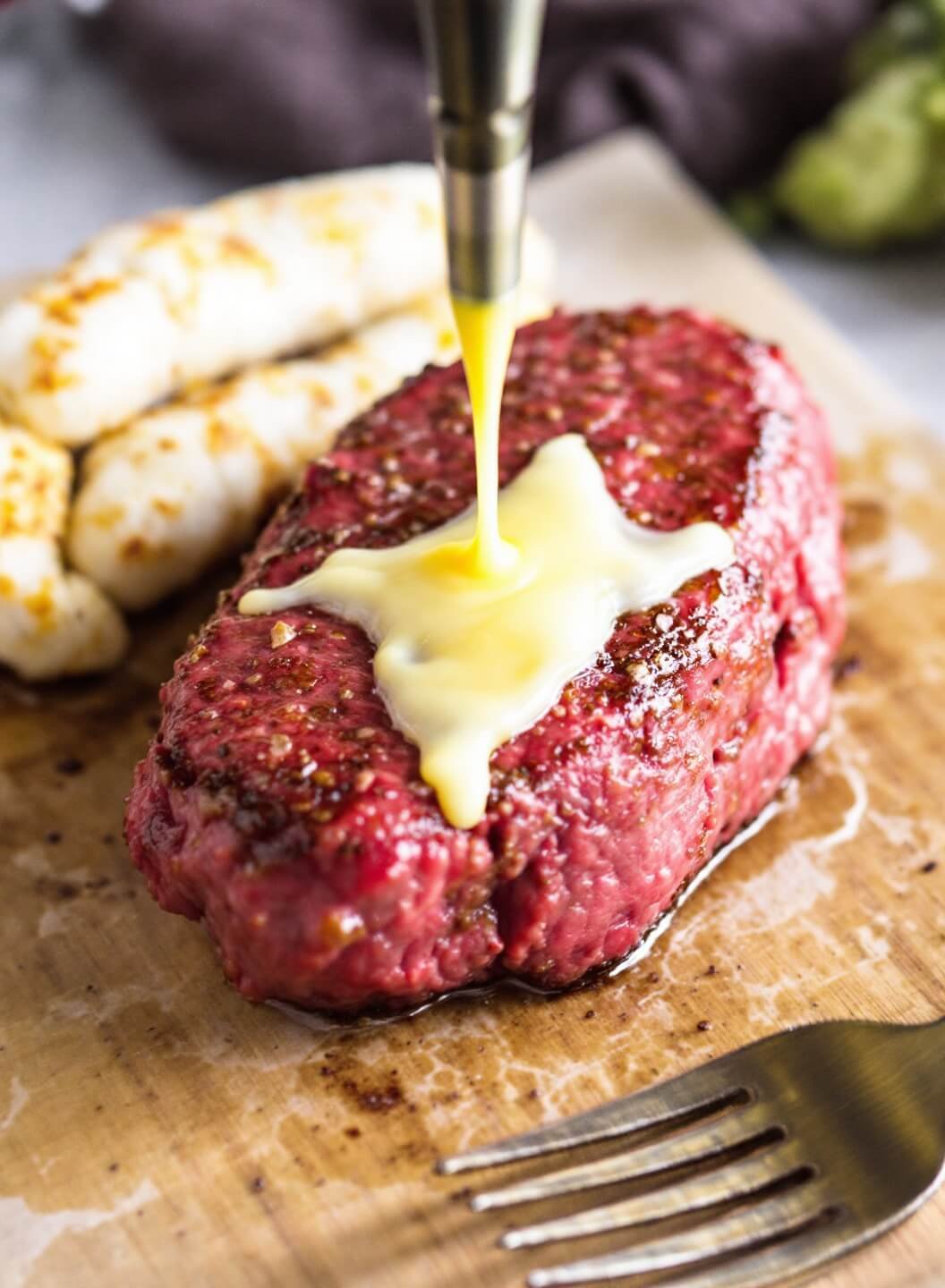 Keto Beef Wellington With Fathead Dough Crust 4 Searing beef tenderloin with a golden crust forming in sizzling butter