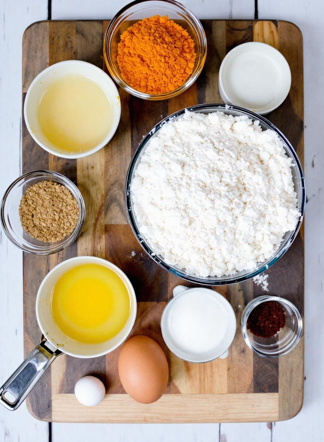 Low-Carb Beef Empanadas (Almond Flour Crust) 3 Raw ingredients including almond flour, eggs, and spices arranged on a rustic wooden board