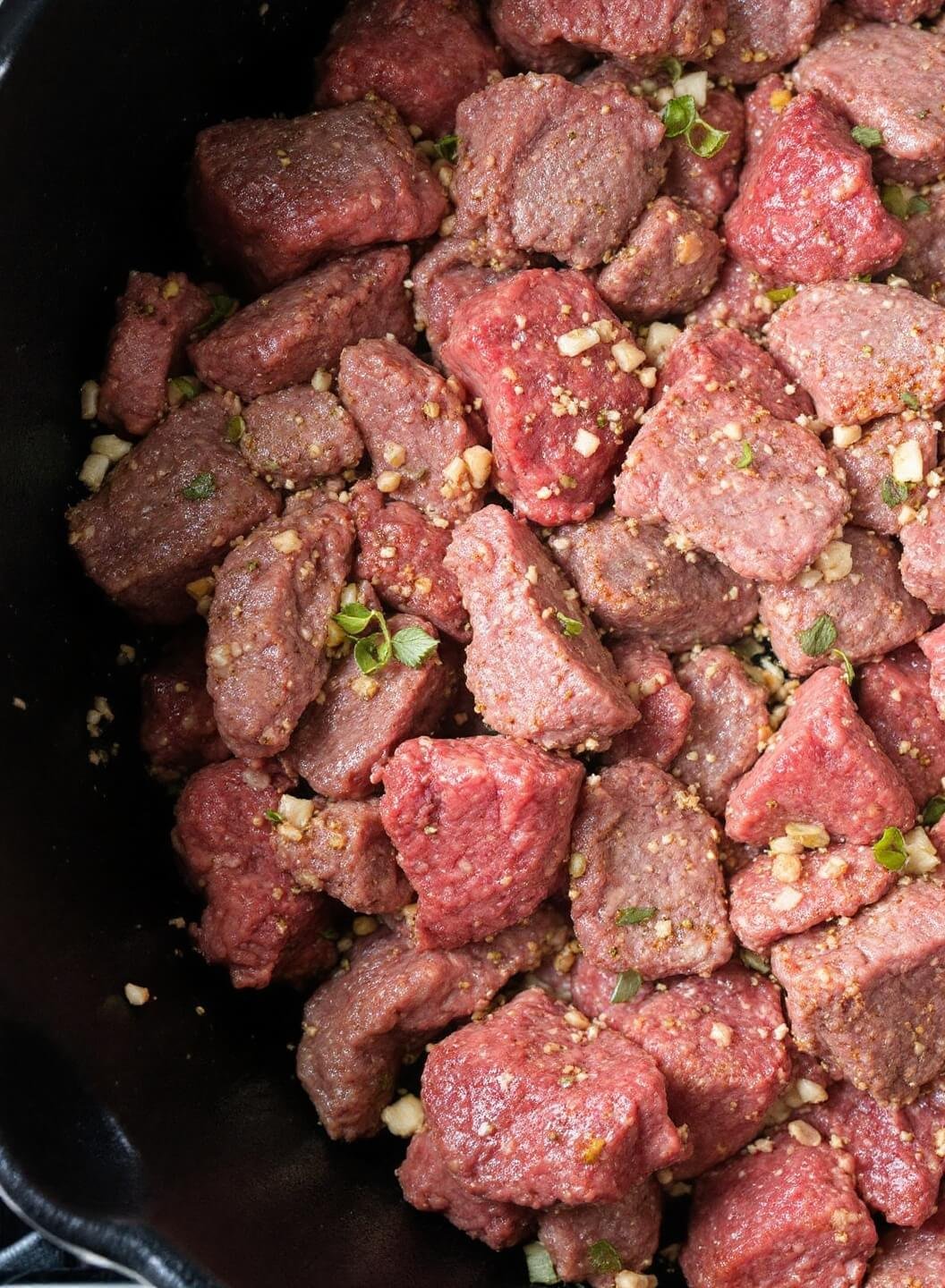 Low-Carb Beef Empanadas (Almond Flour Crust) 4 Sizzling beef filling in a cast iron pan with aromatic spices and steam rising