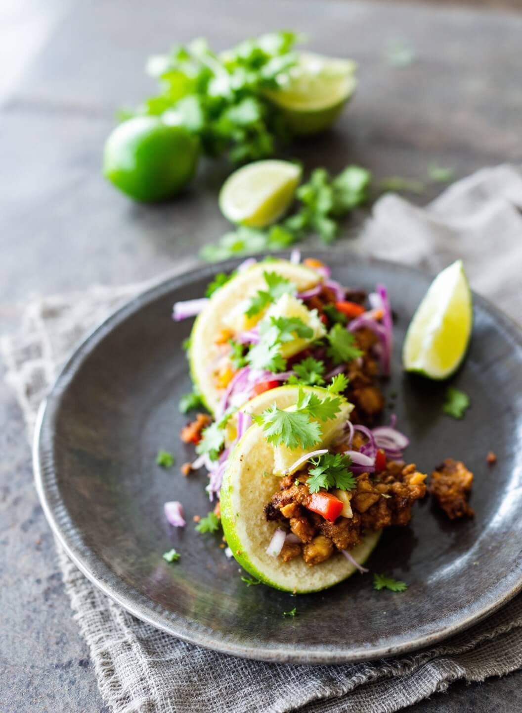 Slow-Cooked Pork Carnitas (Low-Carb) 7 Plated carnitas garnished with fresh cilantro and lime wedges