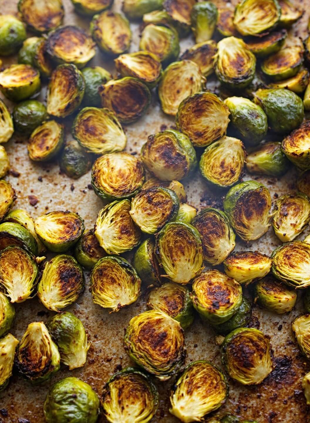 Vegan Keto Buddha Bowl - A Vibrant Low-Carb Plant-Based Feast 4 Golden brown, crispy roasted brussels sprouts steaming on a rustic baking sheet