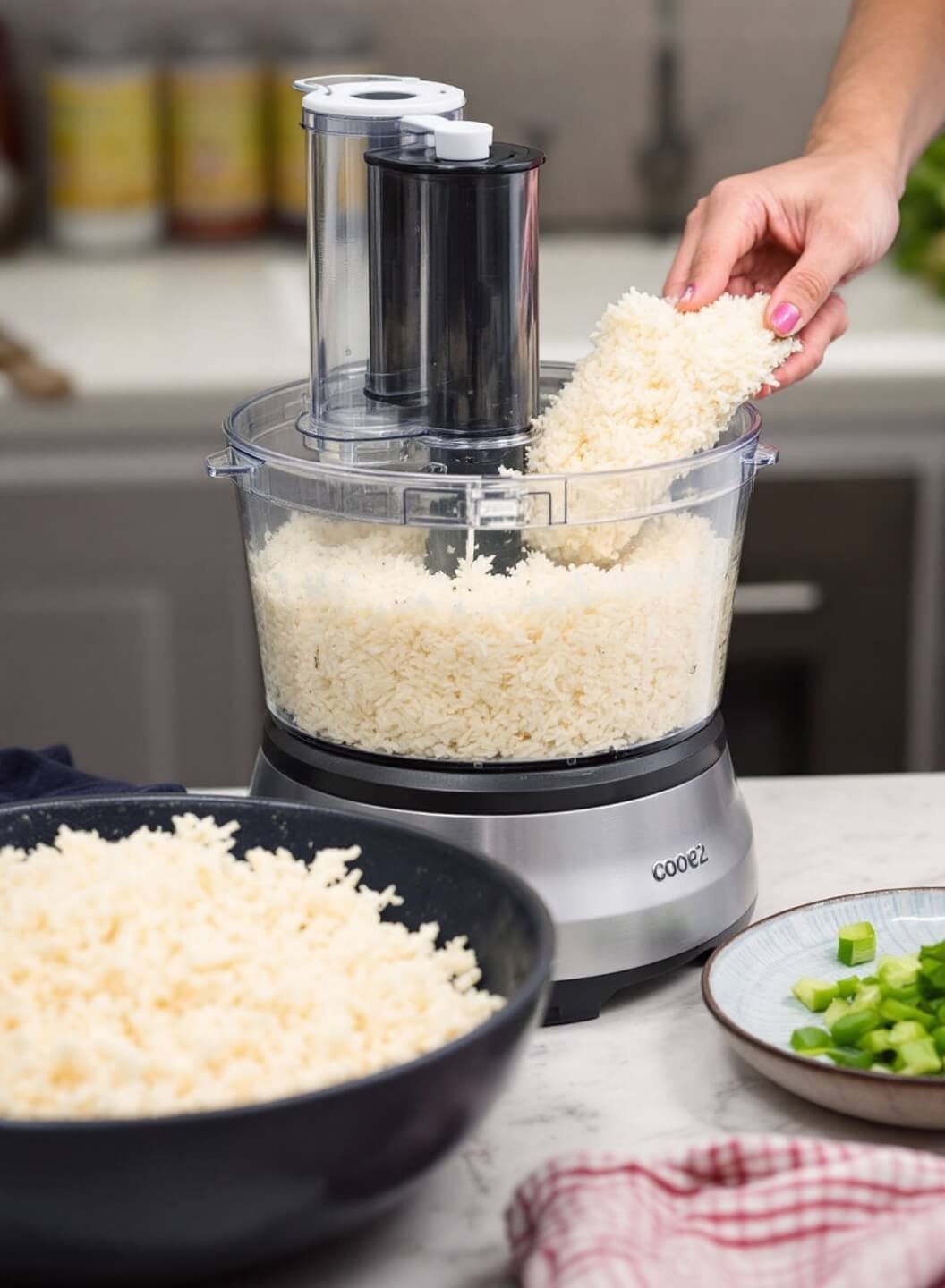 Savory Chicken &Amp; Cauliflower Rice Casserole 4 Processing cauliflower into rice-like texture in a food processor in a bright kitchen setting