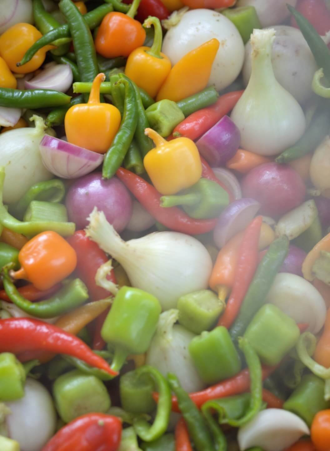 Spicy Cajun Keto Jambalaya With Cauliflower Rice 5 Sautéing onions, peppers, celery, and garlic, creating a vibrant display of colors and aromatic steam