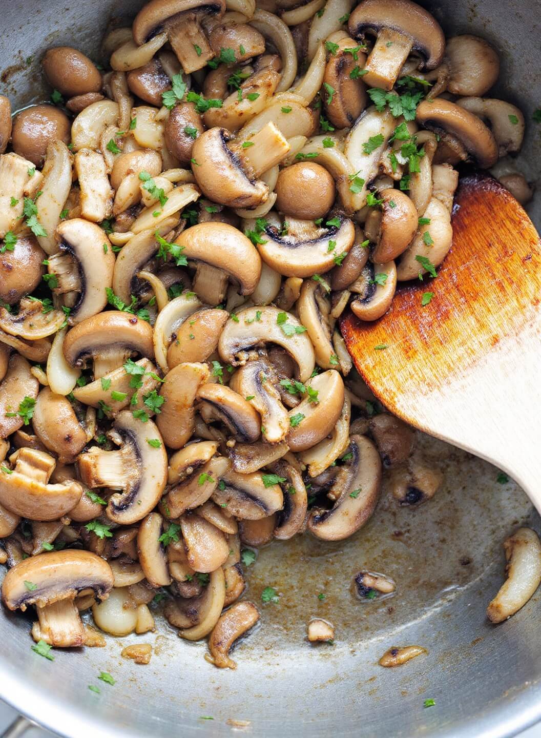 Zesty Beef Stroganoff With Zucchini Noodles 6 Caramelizing sauteed mushrooms and onions with garlic and herbs in a pan