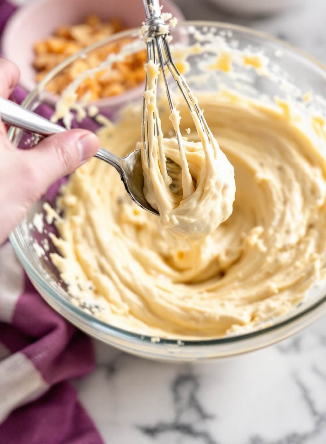 Keto Cinnamon Rolls (Fathead Dough) 3 Melted cheese mixture in a glass bowl under warm kitchen lighting
