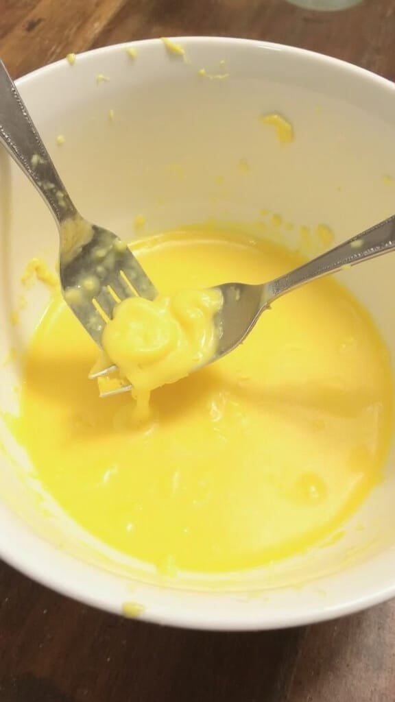Classic Deviled Eggs Recipe (Easy Mayo &Amp; Mustard Base) 5 Mashing creamy yellow ingredients in a mixing bowl with a fork