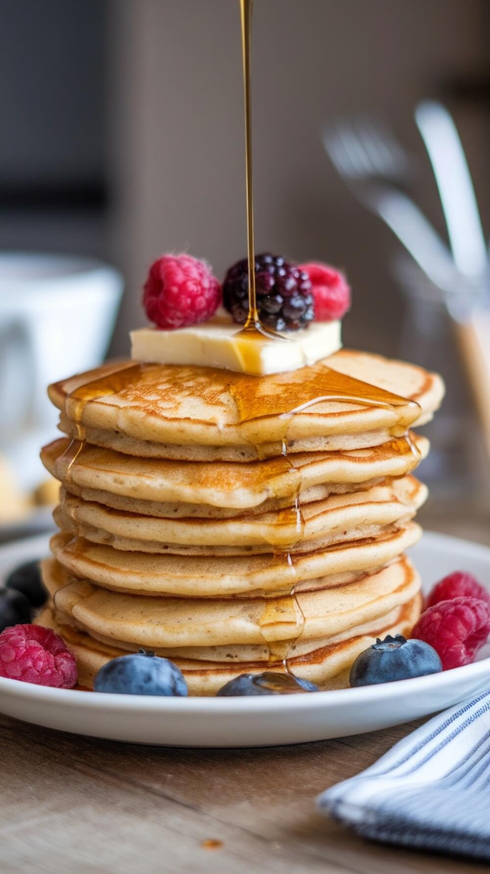 Deliciously Healthy Breakfast &Amp; Brunch Ideas π₯ 7 A stack of fluffy coconut flour pancakes topped with butter, syrup, and fresh berries.