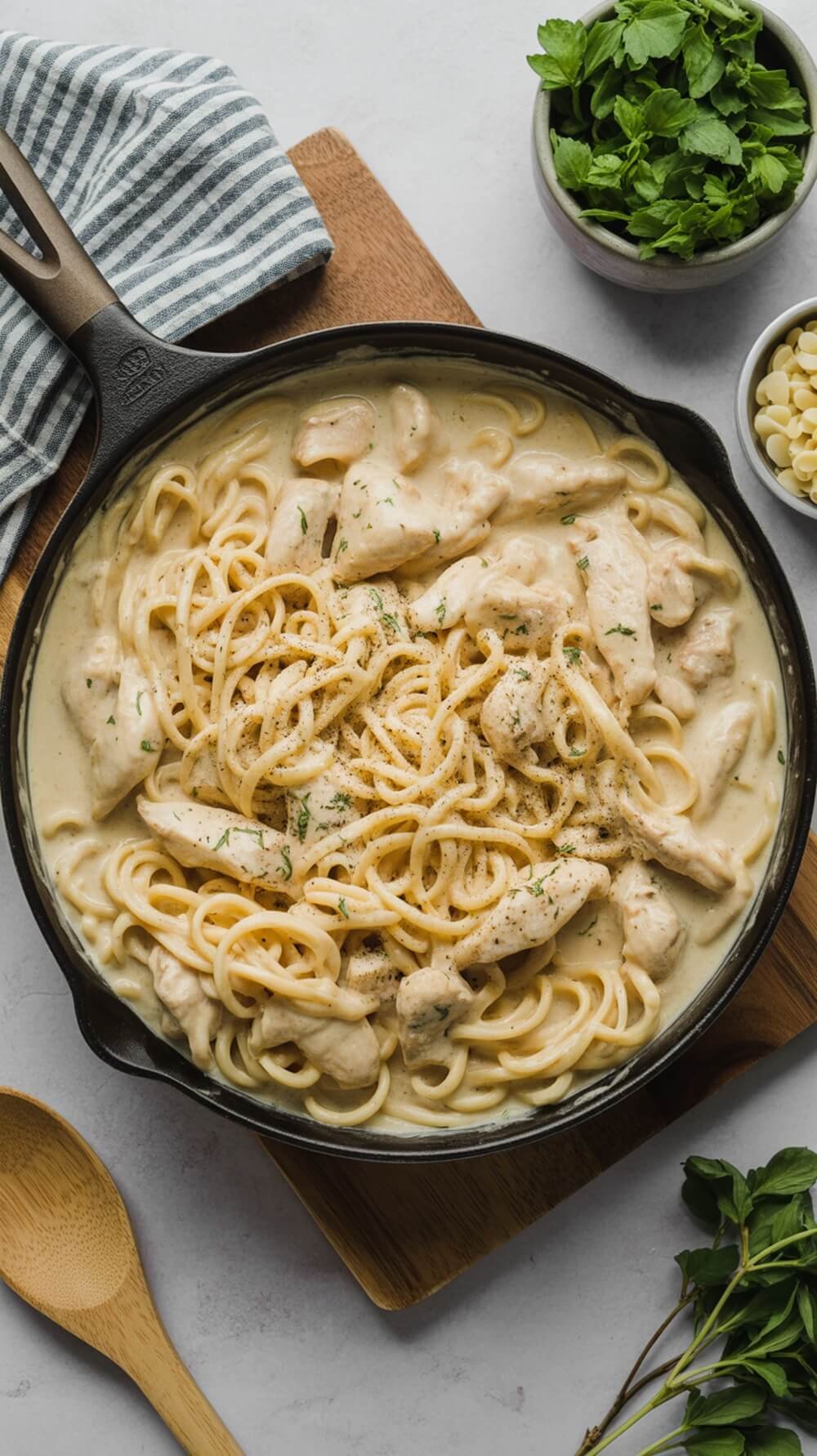 A delicious one-pan keto chicken alfredo with chicken and pasta in a creamy sauce.